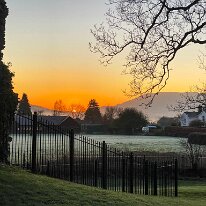 IMG_4026 The rising sun over te town from Castle Park.